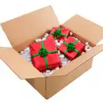 A shipping box full of wrapped presents.