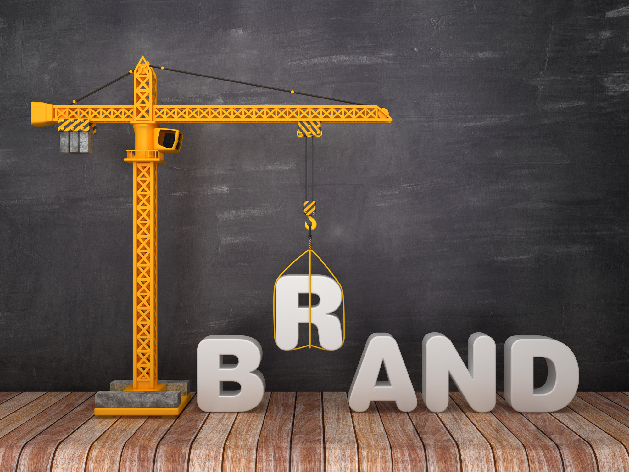 A crane lifting the "B" in "Brand"