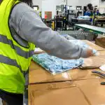 workers packaging items in a fulfillment center