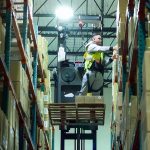 Fulfillment center worker on lift
