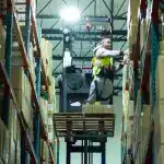 Fulfillment center worker on lift
