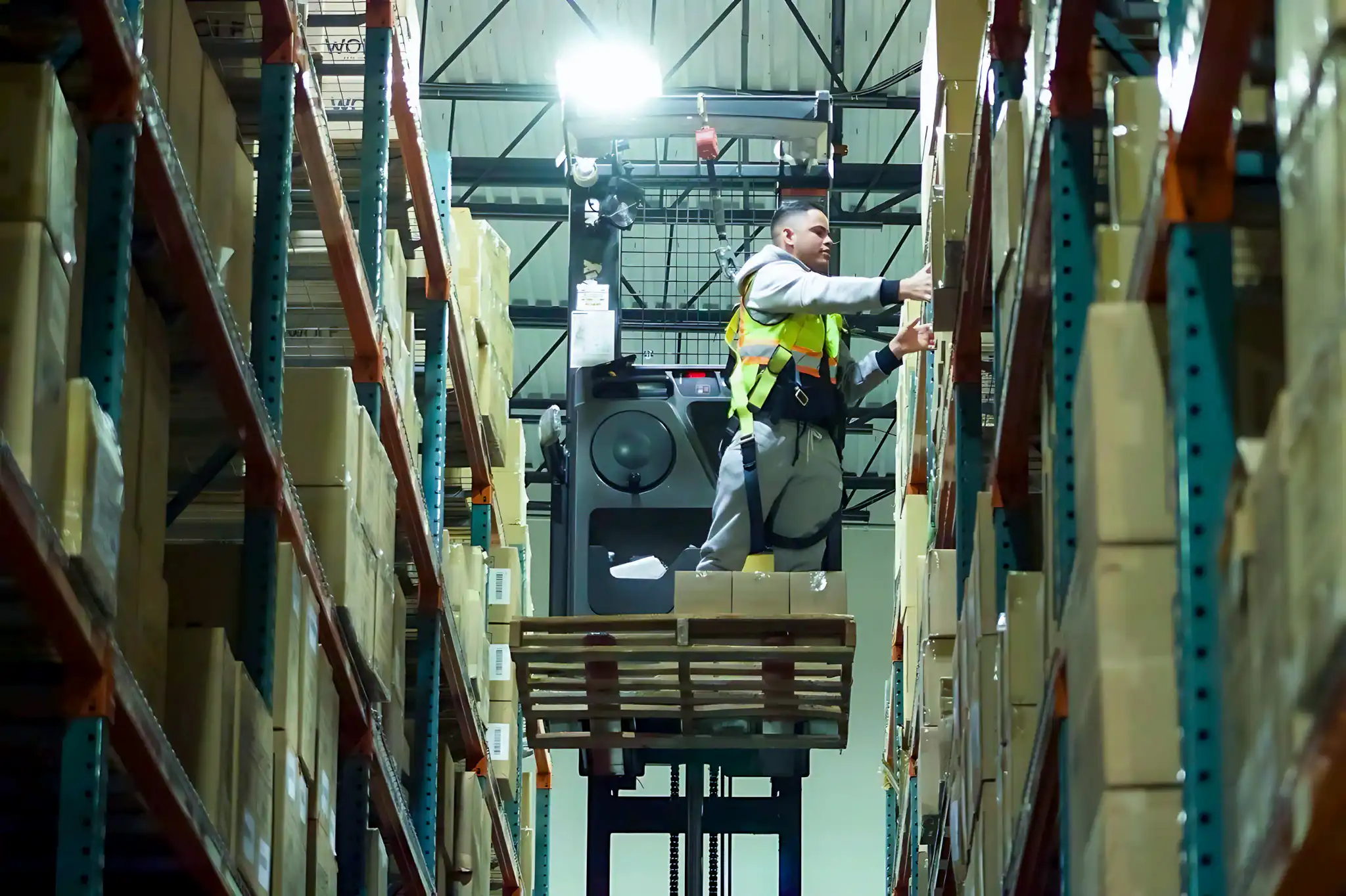 Fulfillment center worker on lift