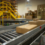 boxes on conveyer belt at omnichannel fulfillment center