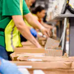 Employee packing an order.