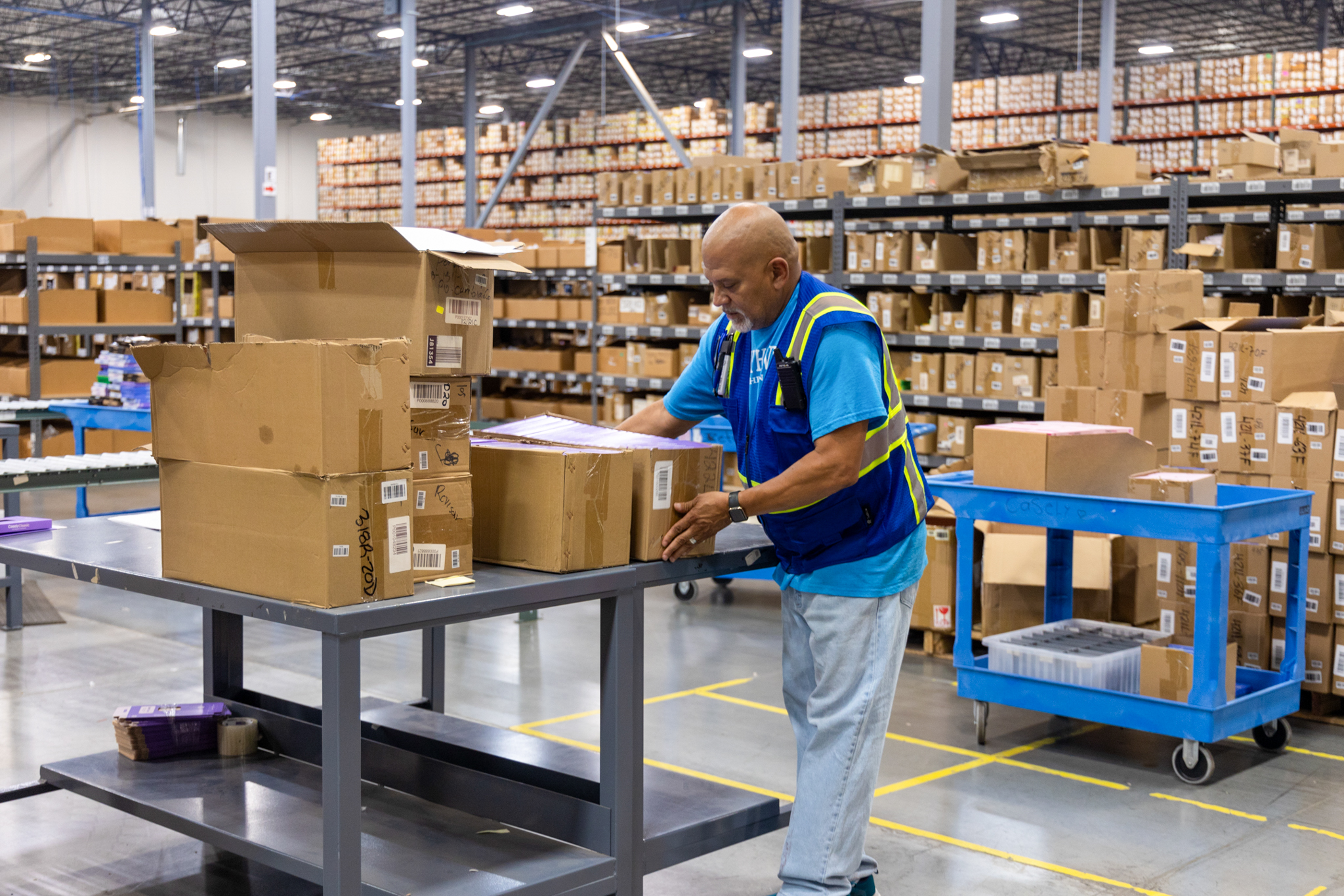 Employee looking over packing