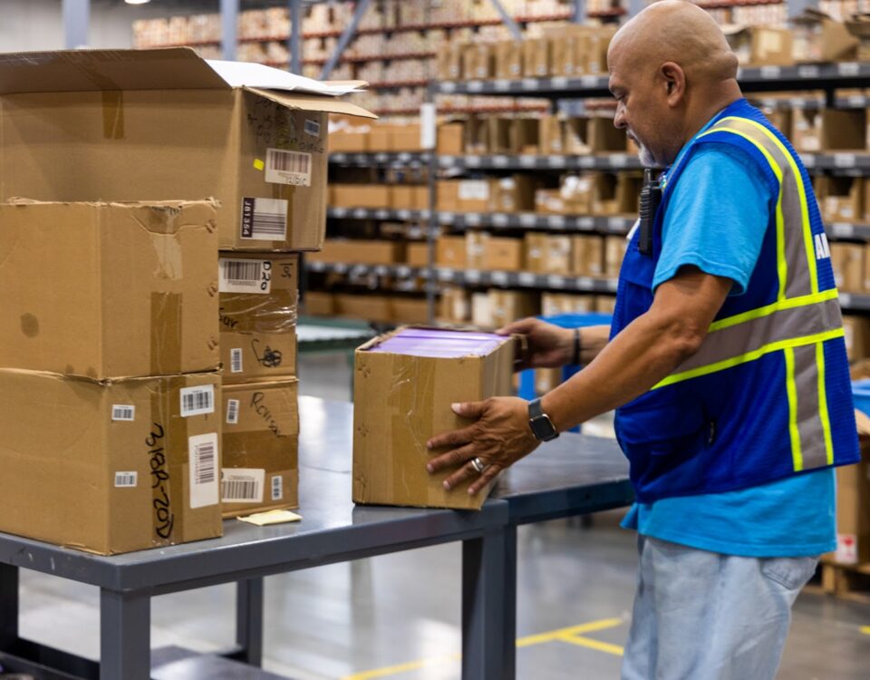 Man working in cosmetics fulfillment center